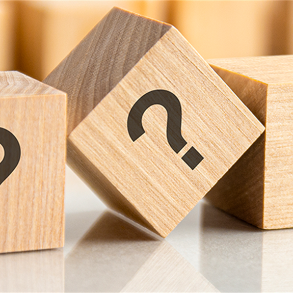 Wooden blocks with question marks